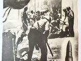 an old black and white photo of a man holding a gun