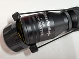 a close up of a camera lens on a white surface