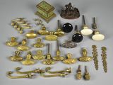 a lot of antique brass items on the table