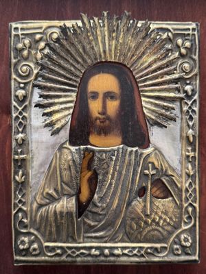 une image représentant Jésus avec une auréole au-dessus de la tête