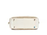the small white bag has a blue button on the front