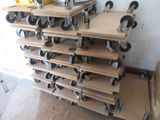 a stack of shelves with wheels on them in a room