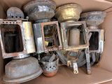a cardboard box filled with many different types of pots and pans