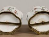 pair of antique porcelain salt and pepper shakers with floral designs
