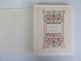 an open book with a picture of a floral design on it