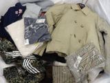a pile of clothes in a plastic bag on the floor