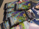 a pile of dvds on a table next to a bag of candy