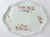 a white plate with a floral design on it