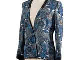 a woman ' s jacket with a blue and black floral pattern