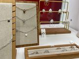 a display of jewelry on display in a glass case