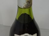 a bottle of wine that is sitting on a table