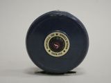 a blue plastic object with a red star on it