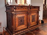 a large wooden cabinet in the middle of a room