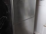an image of a stainless steel refrigerator in a kitchen
