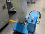 a machine that is sitting on the floor in a factory