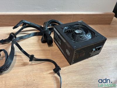 a close up of a computer power supply sitting on a table