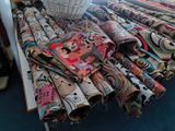 a lot of folded fabric on a table in a room