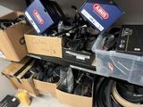 many boxes of cables and other electronics on the floor