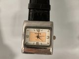 a watch that is sitting on a glass table