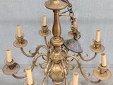 a chandelier that has many candles on it