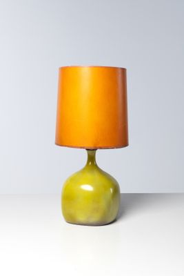 yellow and orange table lamp sitting on a white surface