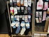 many pairs of socks on display in a store