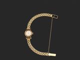un bracelet en or auquel est suspendue une montre sur le côté