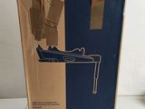 the box is open and ready to be packed with a pair of shoes
