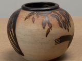 a black and white vase sitting on a table