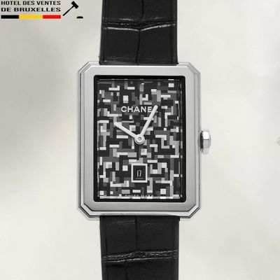 a watch with a qr code on the face of it