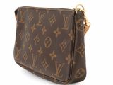 a close up of a brown louis vuitton purse on a white background