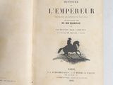 an open book with a drawing of a man riding a horse