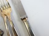 a knife, fork, and spoon sitting on a table