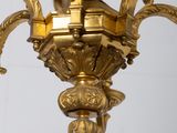 a gold colored chandelier hanging from the ceiling