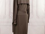 the back of a brown coat on a mannequin mannequin stand