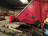 a large red piece of machinery in a building