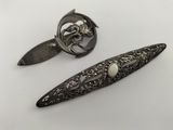 pair of antique silver plated hair clips and a broocher