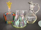 three glass vases sitting next to each other on a table