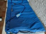 a mattress that has a blue cover on it