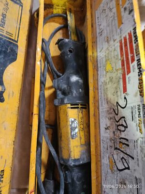 a yellow box with a black and yellow fire hydrant in it