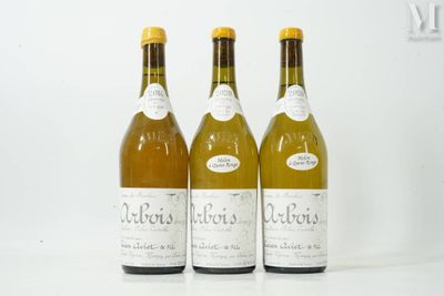 three bottles of wine sitting next to each other on a table