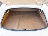 a trunk of a white car with the top open