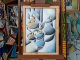 a picture of a painting on a easel in front of a wall