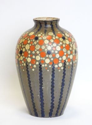 a vase that is sitting on a white surface