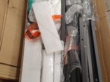 a box full of assorted items sitting on the floor