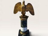 a statue of an eagle on top of a pillar