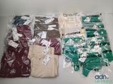 a lot of clothes that are wrapped in plastic bags