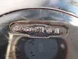 a close up of a metal object with chinese writing on it
