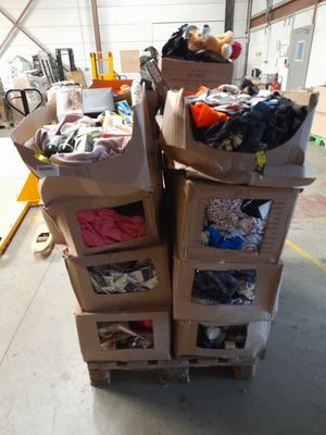 many boxes stacked on top of each other in a warehouse