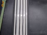 three black and white toothbrushes in a package